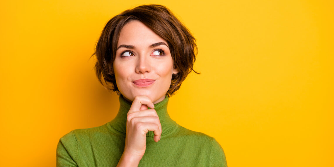 yellow background and lady thinking