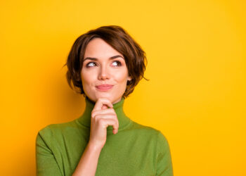 yellow background and lady thinking