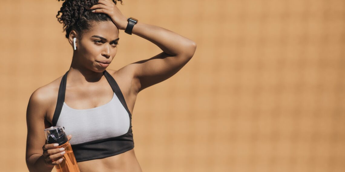 woman in workout clothes looking fit
