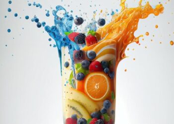 Colorful fruits splashing into milk and juice, creating a vibrant and dynamic liquid explosion.