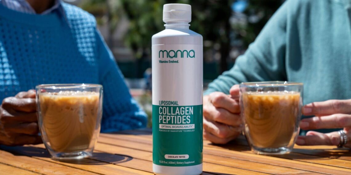 A bottle of liposomal collagen peptides supplement sits on a wooden table between two people holding glasses of iced coffee.